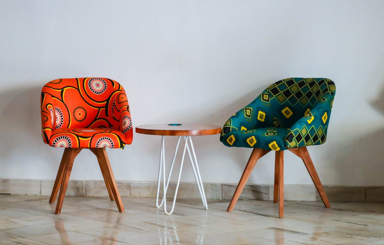 pexels-photo-1350789 Brightly colored modern chairs and table in a minimalist room for vibrant decor ideas.
