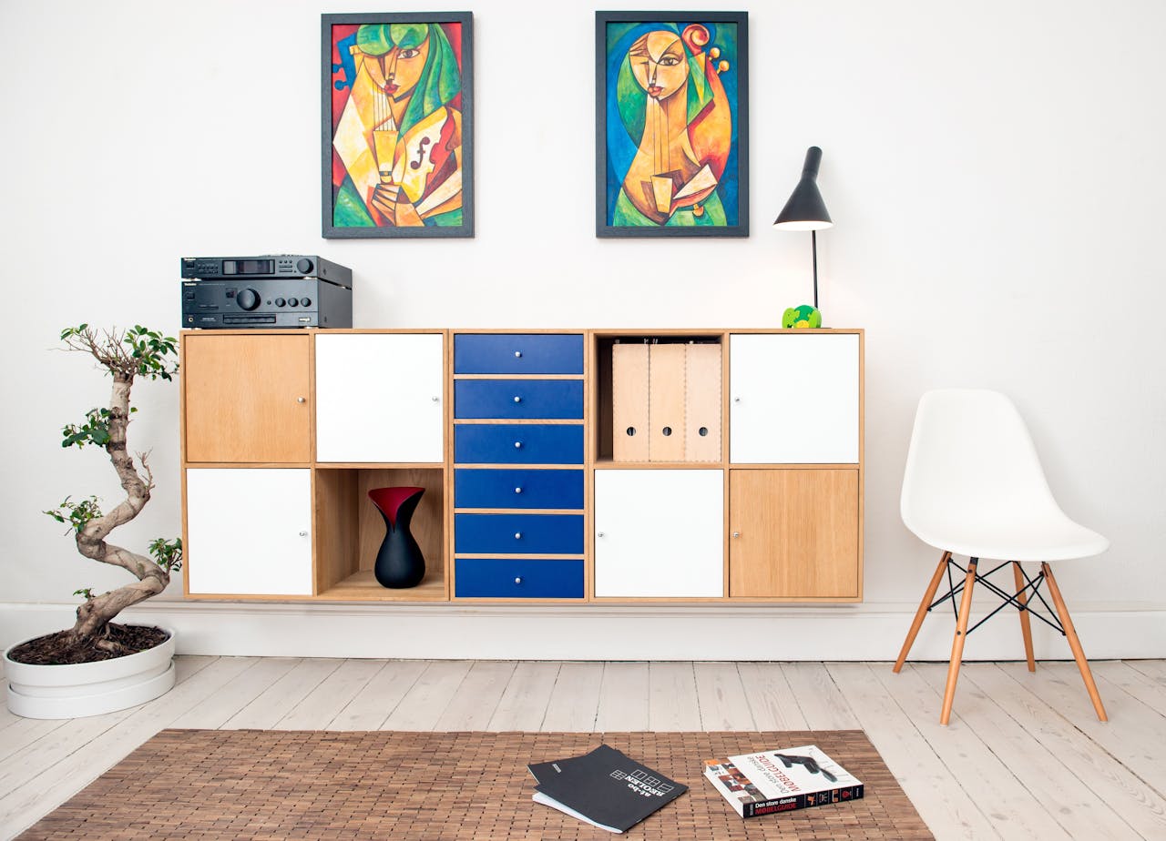 services-02 Contemporary room design featuring colorful artwork, sleek furniture, and decorative elements.